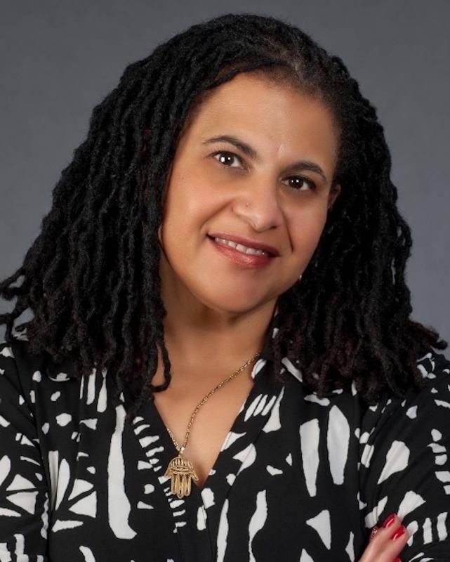 Portrait of Black woman with long braided hair. 