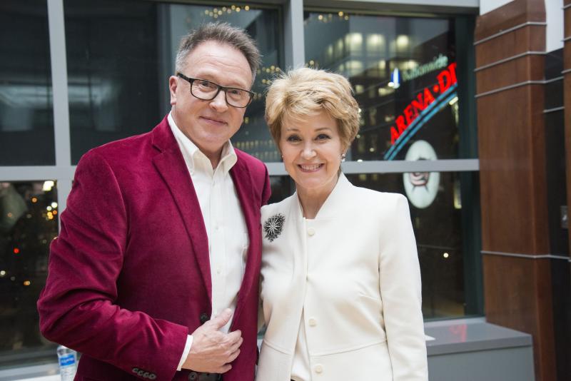 Photo of a White man and a White woman smiling
