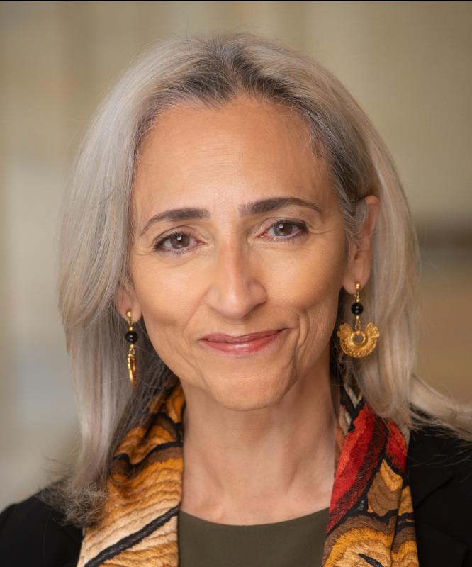 headshot of an older Latina woman with long gray hair