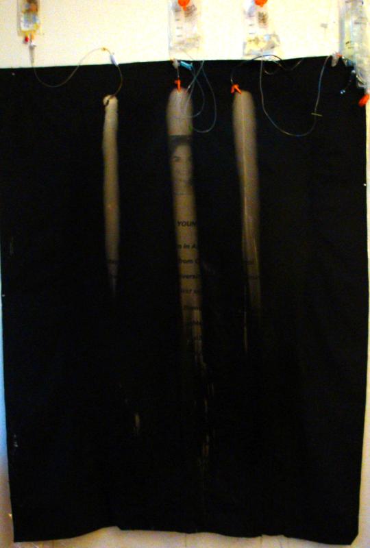 partially obscured silkscreened image and text