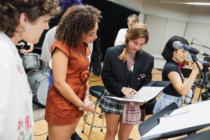 Sydney Gray providing feedback during rehearsals of her original song