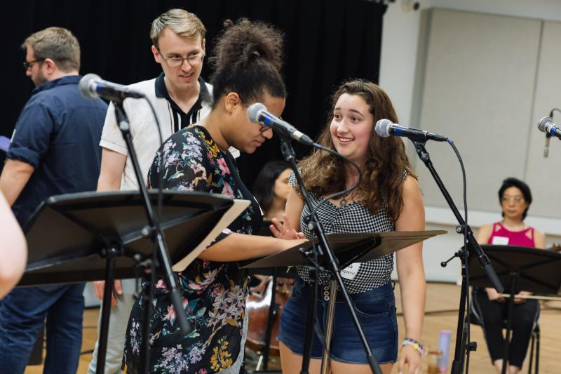 Luisa Paraguassu providing feedback during rehearsals of her original song, "Talk Pretty."