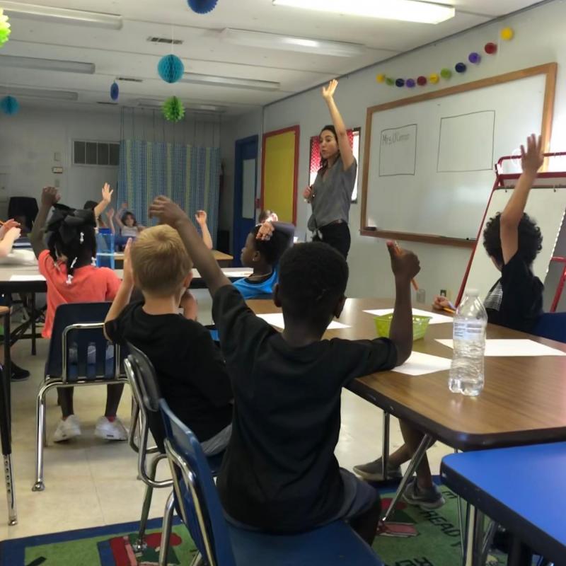 Teaching artist works with class