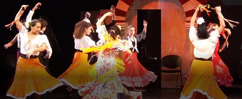 Dancers performing in traditional skirts and blouses
