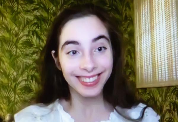 Headshot of a young woman smiling.