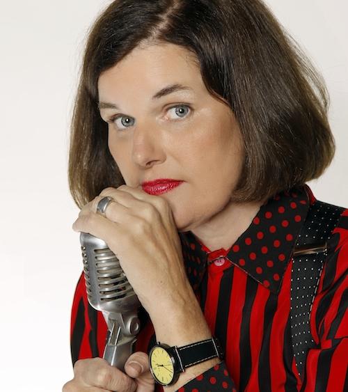 Paula Pondstone photo. She is shown clutching an old style radio microphone.