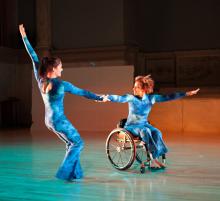 Two dancers in wheelchair and standing