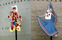 Two of the five metal cutout dancers -- a Yakama fancy dancer and a Mexican dancer -- displayed in a Wapato park