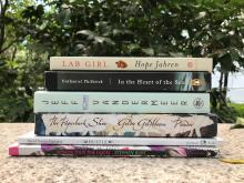 a stack of new Big Read books in a garden setting