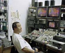 Nam June Paik in his video-editing studio in his home on Mercer Street, New York, 1999. Photo by David Heald