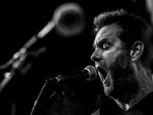 Man singing into a microphone