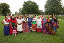 A group of Latin American women some in traditional dress
