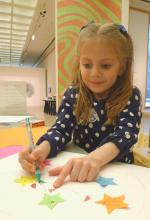 Child drawing stars