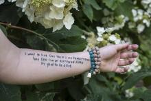 A tattooed arm belonging to a suicide survivor