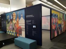 a large class room with colorful murals painted on the outside walls