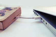 Book connected to computer by wire