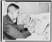 Dr. Seuss drawing an image of the grinch