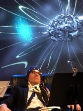Reclining man wearing EEG cap