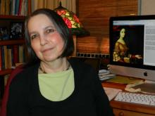 photo of woman in front of computer screen