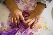 A child's hands with fingerpaint