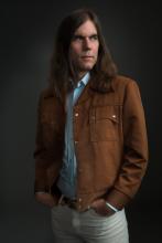 a medium shot of composer Graham Reynolds