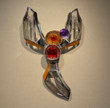 Phonix-like sculpture made of car fenders