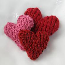 Three knitted hearts