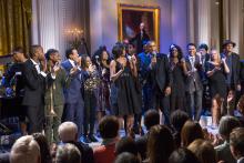 President Obama on stage at the White House with musical performers.