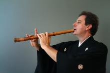 James Nyoraku Schlefer playing an instrument. 