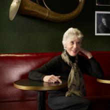 Photo of a woman sitting at a table