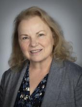 Headshot of a blonde, middle aged woman