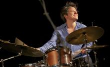 A woman playing the drums