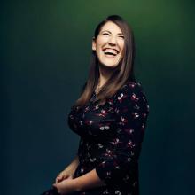 Portrait of woman with brown hair laughing