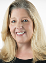 Headshot of a smiling woman with blonde hair