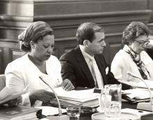 Toni Morrison reading applications at a meeting.