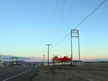 A neon sign outside the town of Green River, Utah.