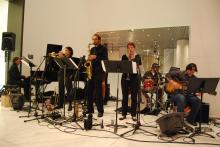 A band playing at a museum. 