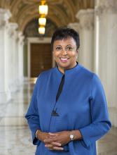 Portrait of Carla Hayden in a hall in the Library of Congress. 