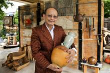 Man holding ceramic vase