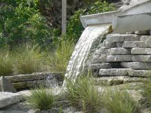 A fountain made of a cut stormwater pipe