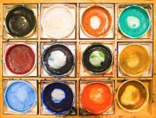 The inside of a paint box