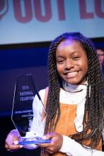 Janae Kegley holding her Poetry Out Loud National Champion award