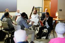 Musicians playing for an elderly audience