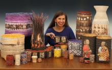 a native american woman with long dark hair surrounded by a selection of handwoven baskets featuring photographs and snippets of texts