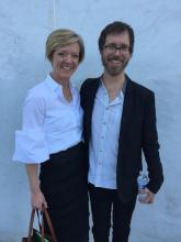 a white woman and a bearded white man with glasses