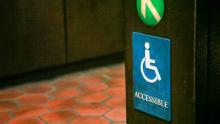 A sign indicating a wheelchair-accessible entrance on the Washington, DC Metro system