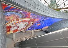 a mosaic comprising a series of multi-colored concentric circles of diverse sizes