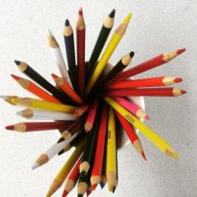 a cup of colored pencils point-side up