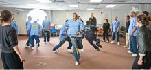 Prisoners running in circles as a theater exercise. 