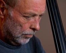 Man holding bass. 